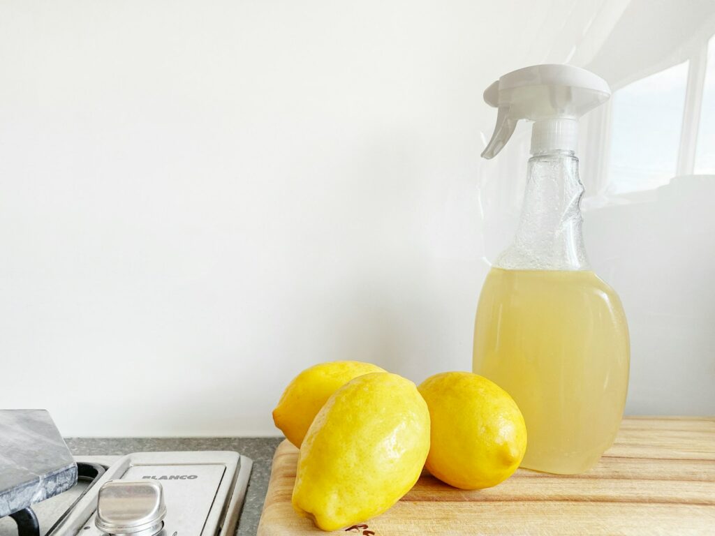 allergen reduction -yellow lemon fruit beside clear glass bottle